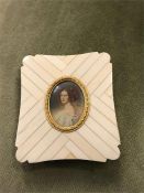 A miniature of a lady in an ivory frame