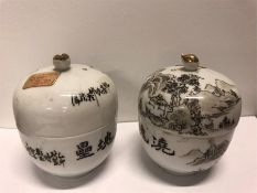 A pair of Chinese hand painted pots