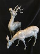 A pair of decorative metal deer.