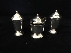 A silver Cruet set hallmarked Birmingham 1946 makers mark B.Ld, Bishtons Ltd (Total Weight 140g)