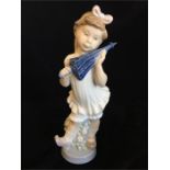 Lladro figure of a girl with an umbrella