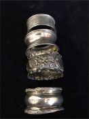 Four Assorted silver napkin rings