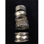 Four Assorted silver napkin rings