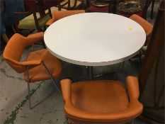 A set of Mid Century chrome and leather chairs by Ben and a circular white table