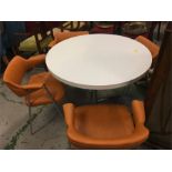 A set of Mid Century chrome and leather chairs by Ben and a circular white table