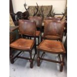 Set of four oak and leather dining chairs