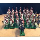 A large selection of hand painted lead figures of a mounted band members.