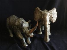 An Ornamental Elephant and matching Rhinoceros