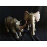 An Ornamental Elephant and matching Rhinoceros