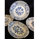 Three Meissen plates and a bowl in blue and white with pierced edging.