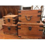 Four wooden storage boxes