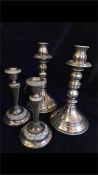 Two pairs of silver plated candlesticks