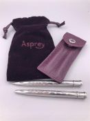 An Asprey Sterling Silver pen and pencil set in Asprey mini lettering embossed leather pouch