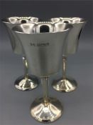 A set of three hallmarked silver goblets (215g)