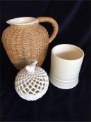 A cream stoneware jug, cream pot and cream lattice pot with bird lid