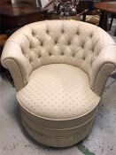 A small cream tub chair