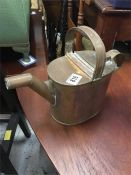 An Antique metal watering can