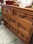 An Indian hardwood two over six chest of drawers