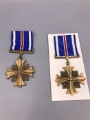 Two Distinguished United States Flying Cross medals