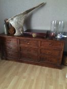 A Teak sideboard with nine drawers 180cm wide x 50cm deep x 80 cm high