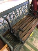 A Wrought iron and wooden garden bench with rose pattern back and small bench seat to match (AF)