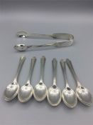 Hallmarked silver sugar tongs and six coffee spoons