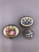 A Trio of white metal and enamel trinket boxes.