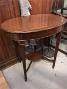 An oval mahogany incidental table