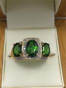 A 14ct yellow gold green garnet and diamond ring