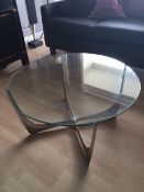 A Mid Century glass and metal coffee table