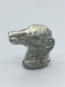 A silverplated vesta case in the form of a dog