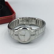 A Ladies Tag Heuer watch with bushed steel case