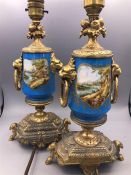 A Pair of hand painted china and gilt lamp bases (One AF)