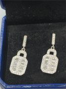 A Pair of silver and CZ panel set earrings