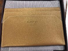 Ten Asprey card slip cases mini lettering in calf leather, nine gold and one red.