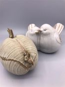 Two Stoneware birds and a stoneware pot with a lid.