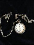 A Silver pocket watch with a masonic fob and albert chains.