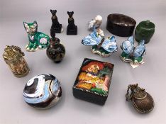 A selection of curios to include Butterflies, cats and glass paperweight.