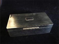 A Silver cigarette box, hallmarked Birmingham