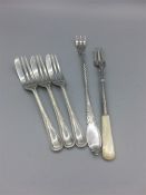 Hallmarked silver to include three cake forks, a pickle fork and a pickle fork with a mother of