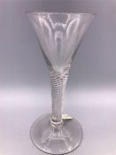 A Georgian wine glass circa 1760 with airt twist stem and drawn trumpet bowl.