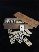 A box of Vintage bone dominoes