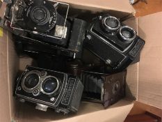 A box of various cameras