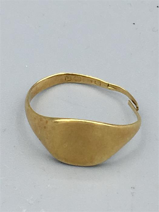 A hallmarked gold signet ring