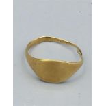 A hallmarked gold signet ring