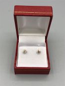 A Pair of white gold diamond stud earrings of 83 points