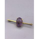 A 9ct gold brooch with amethyst stone