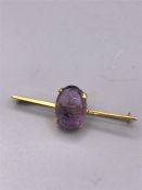 A 9ct gold brooch with amethyst stone