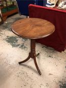 An incidental round mahogany table