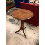 An incidental round mahogany table